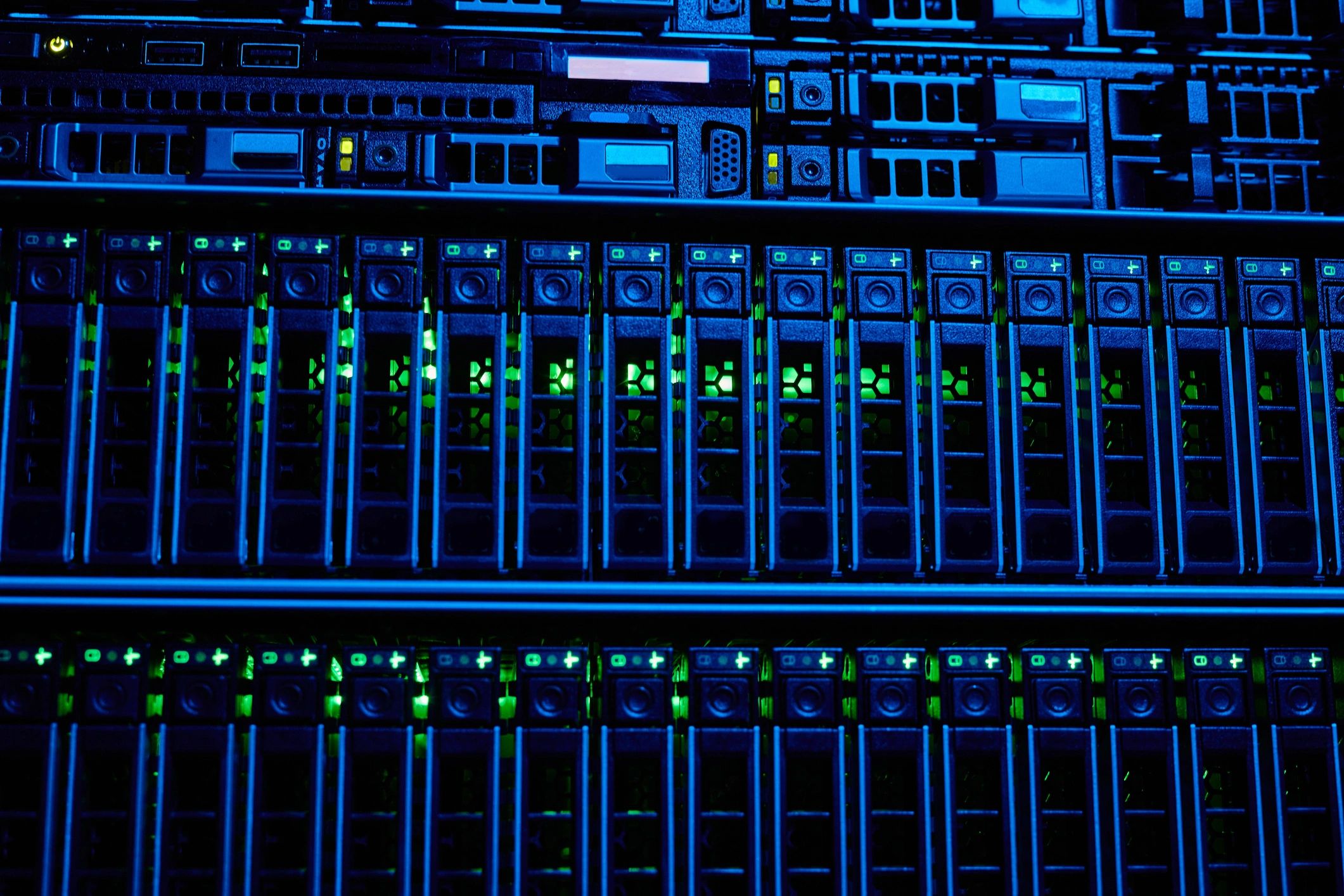 Close-up of server rack hardware in a blue-lit data center